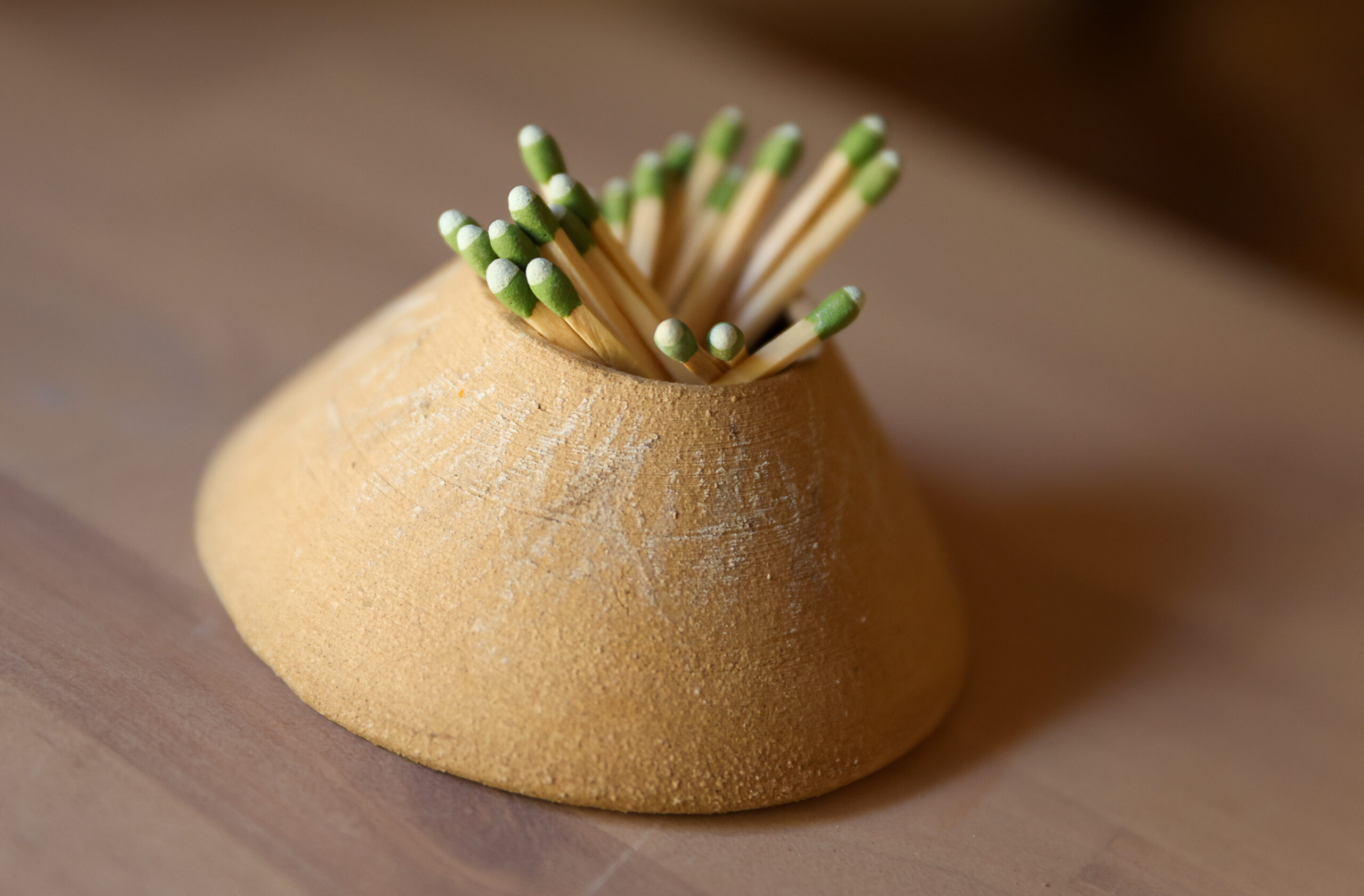 A ceramic match strike made by Hannah Allen in Santa Rosa