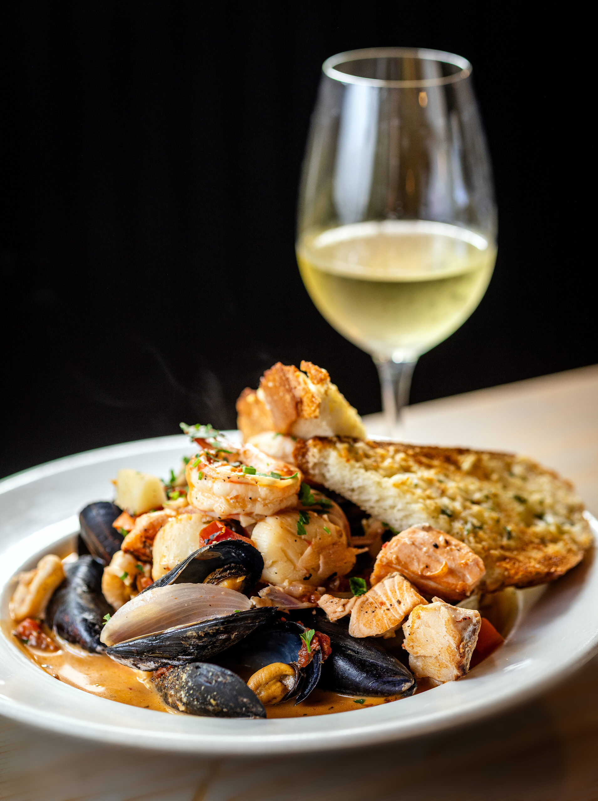 Salt & Stone Seafood Stew with prawns, fin fish, clams, mussels, scallops, calamari, Yukon Gold potatoes, roasted tomato broth and garlic toast from Salt & Stone in the heart of the Sonoma Valley Monday, June 1, 2026 in Kenwood. (John Burgess/The Press Democrat)