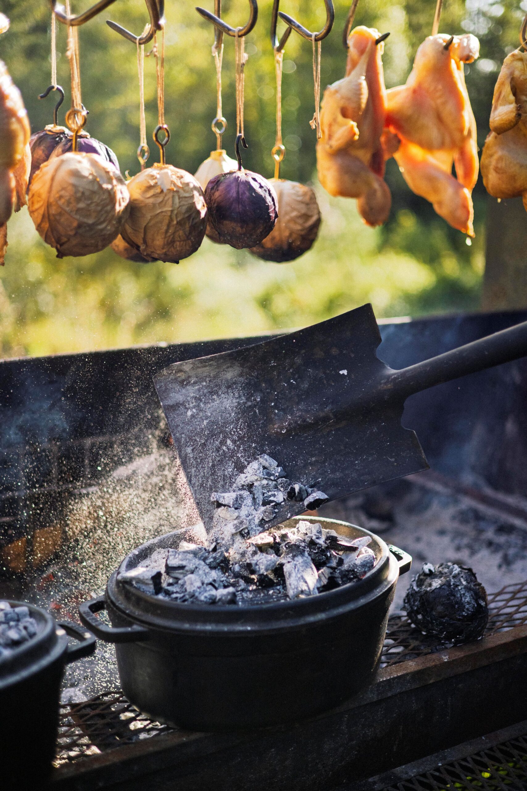 Chef Lee Desrosiers harnesses elements of campfire cooking like wood, coals and cast-iron pots to create elevated meals cooked and served outdoors. (Conor Hagen)