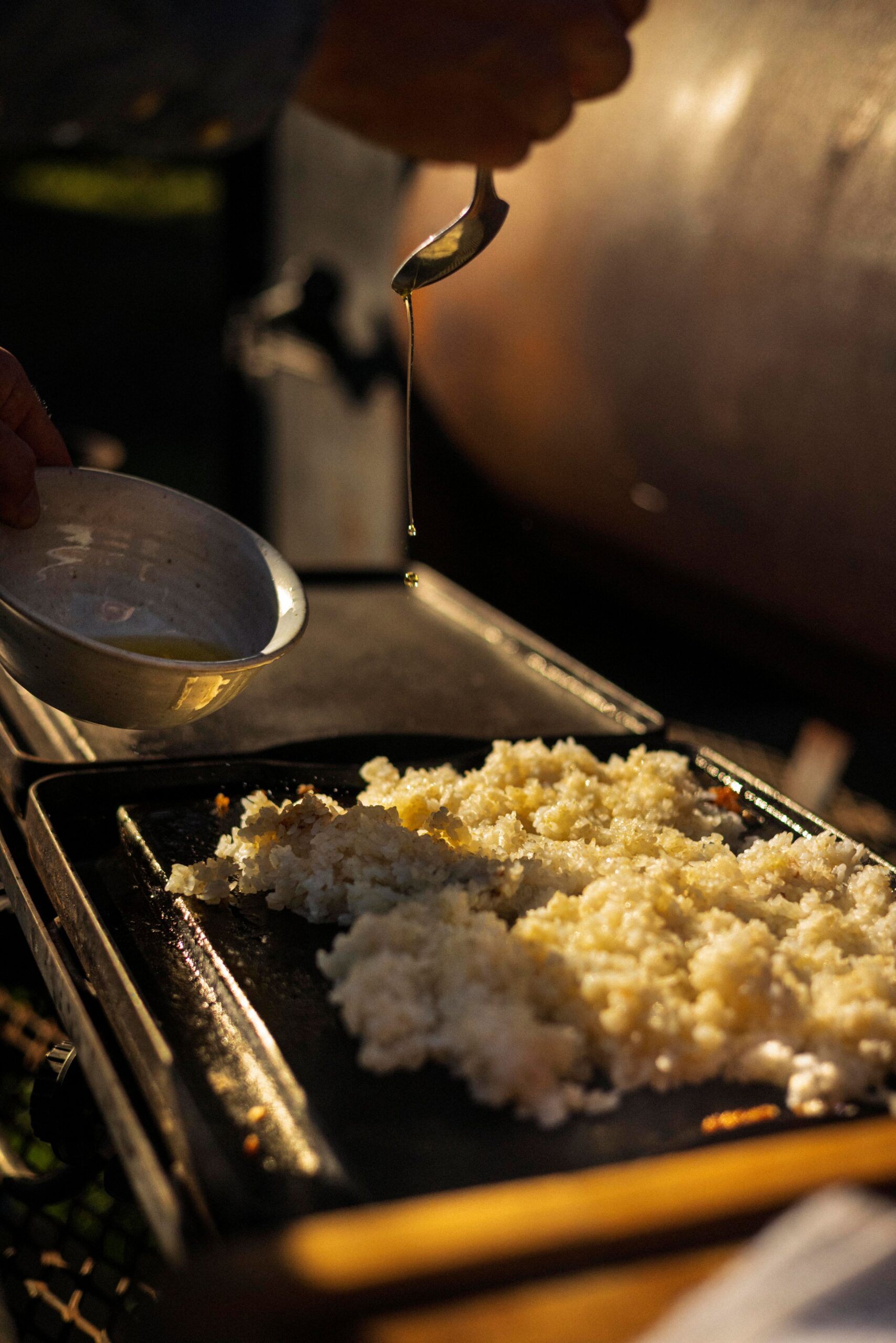 Chef Lee Desrosiers cooks rice in schmaltz for a flavorful dish with crispy edges. (Conor Hagen)