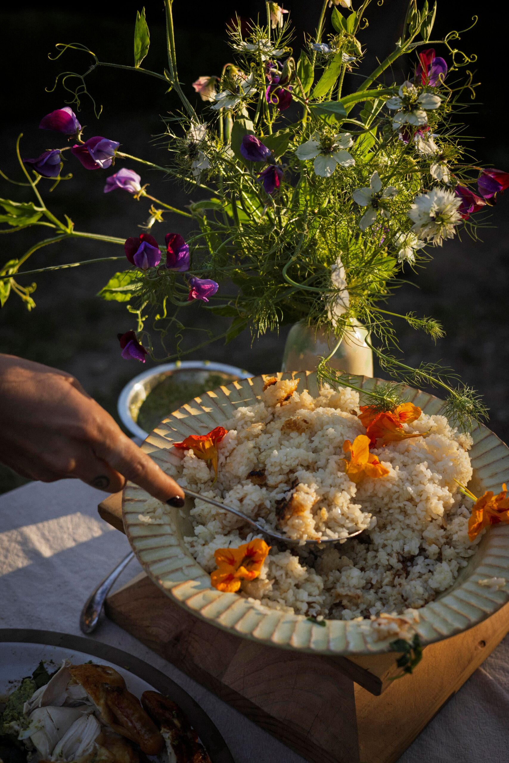 A skillet of rice cooked in schmaltz arrives brown and crunchy at the edges. (Conor Hagen)