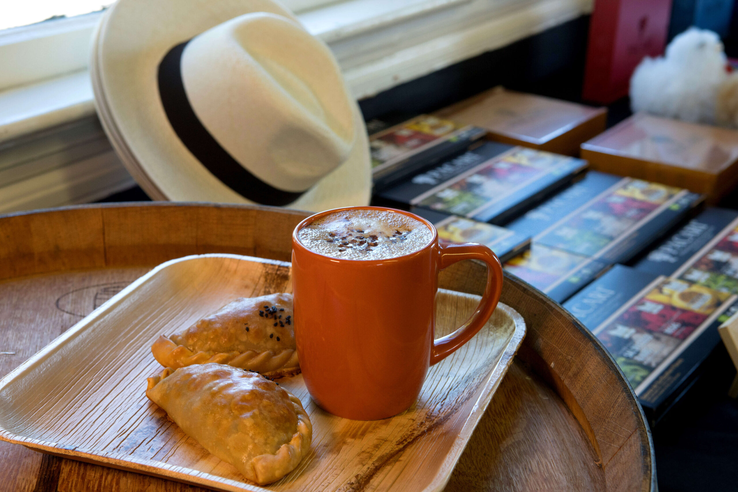 A cardamom mocha latte with two chicken empanadas at Grand Central Petaluma, Saturday, July 9, 2022, in Petaluma. (Darryl Bush / For The Press Democrat)