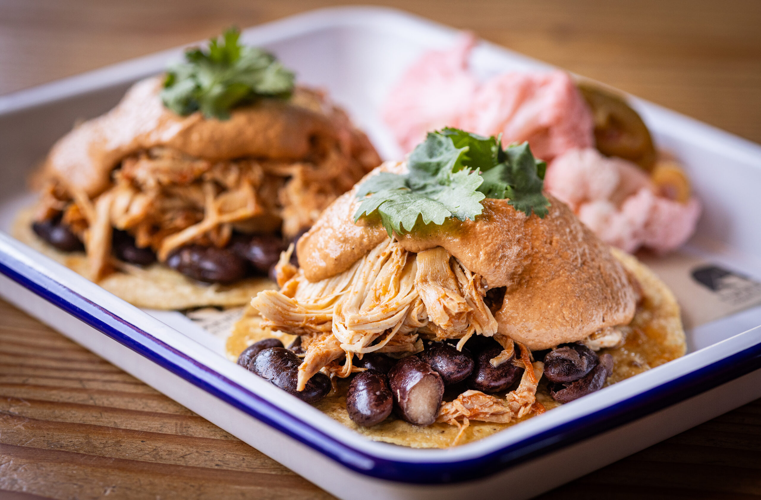 The Pollo Correcto Tostada with organic chicken, fancy beans, CA mole, cilantro and pickled vegetable salad from Handline Thursday, July 9, 2026 in Sebastopol. (John Burgess/The Press Democrat)