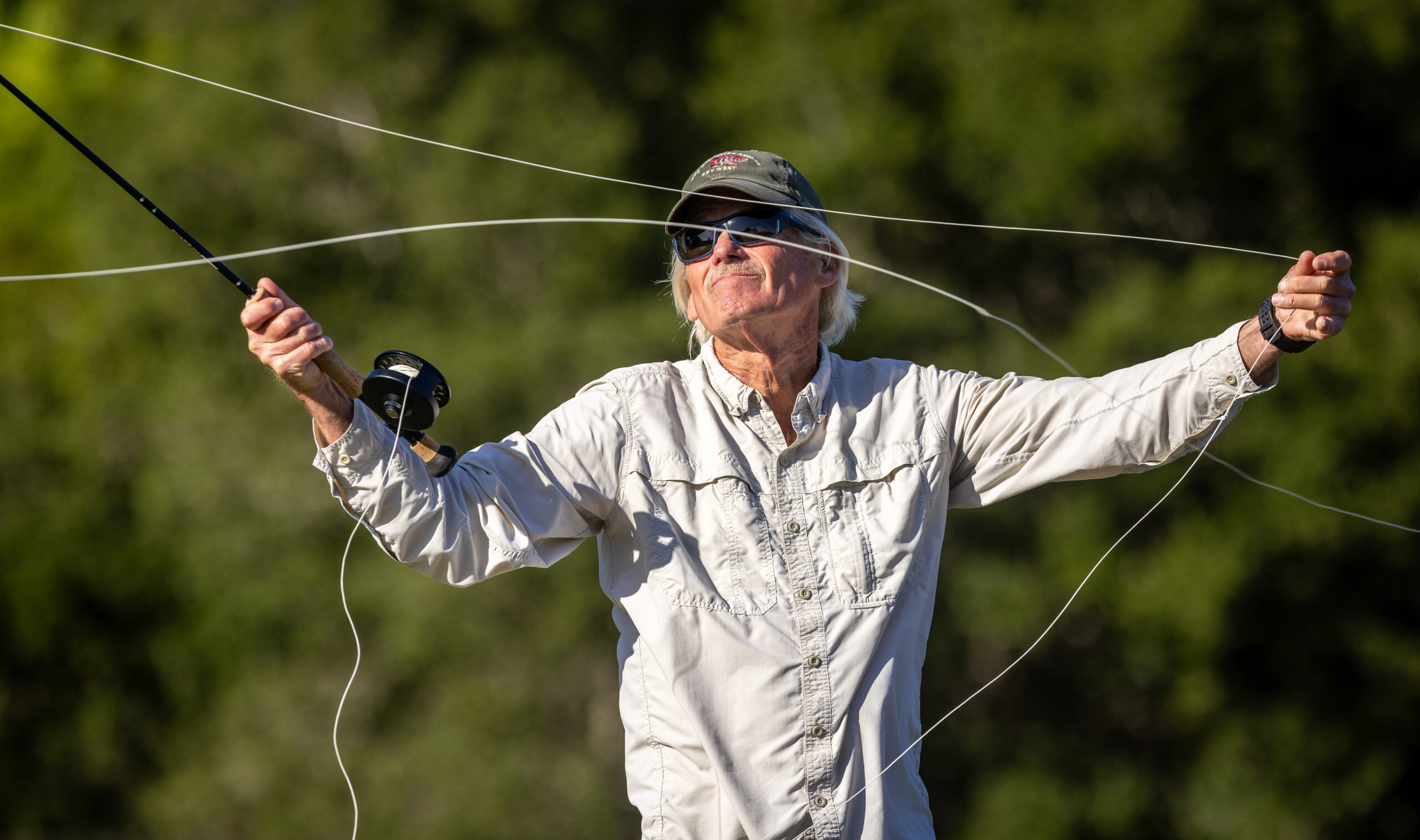 Russian River Fly Casters member Steve Tubbs(?) pulls line for a longer cast while practicing Thursday, May 7, 2026 at the casting pond in Santa Rosa’s Galvan Park. (John Burgess/The Press Democrat)