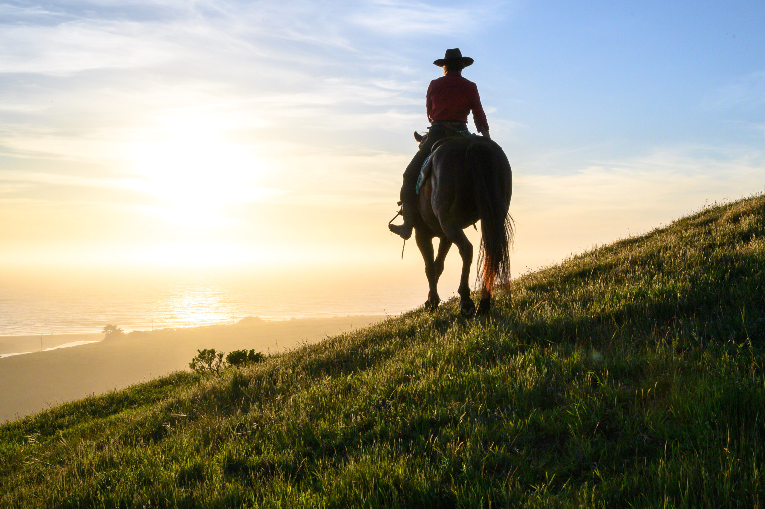 A sunset horseback ride at Chanslor Stables in Bodega Bay. (Benjamin Wheeler / Sonoma County Tourism)