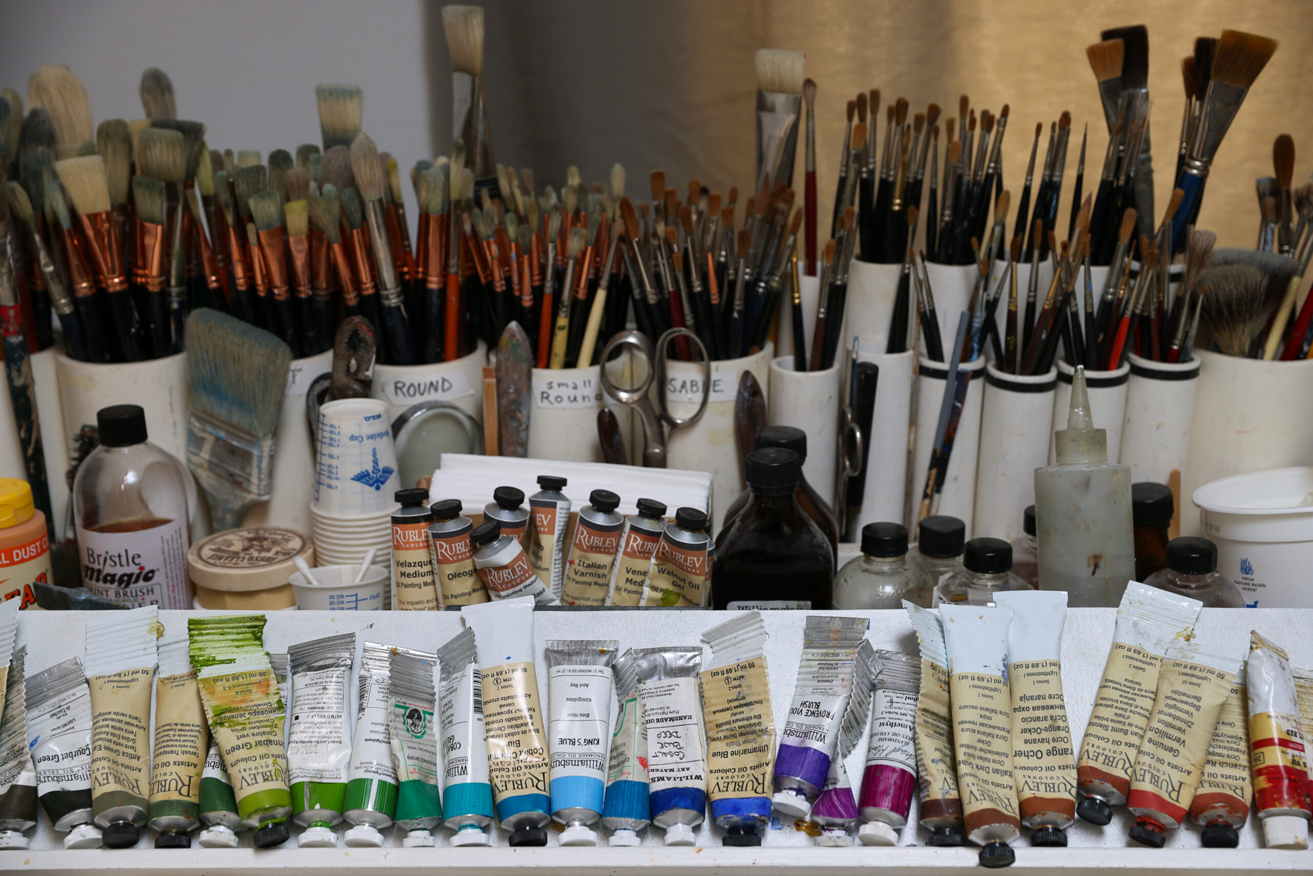 A wide variety of brushes and paints at Christopher Leith Evans’ studio in Healdsburg on Monday, May 11, 2026. (Christopher Chung/The Press Democrat)