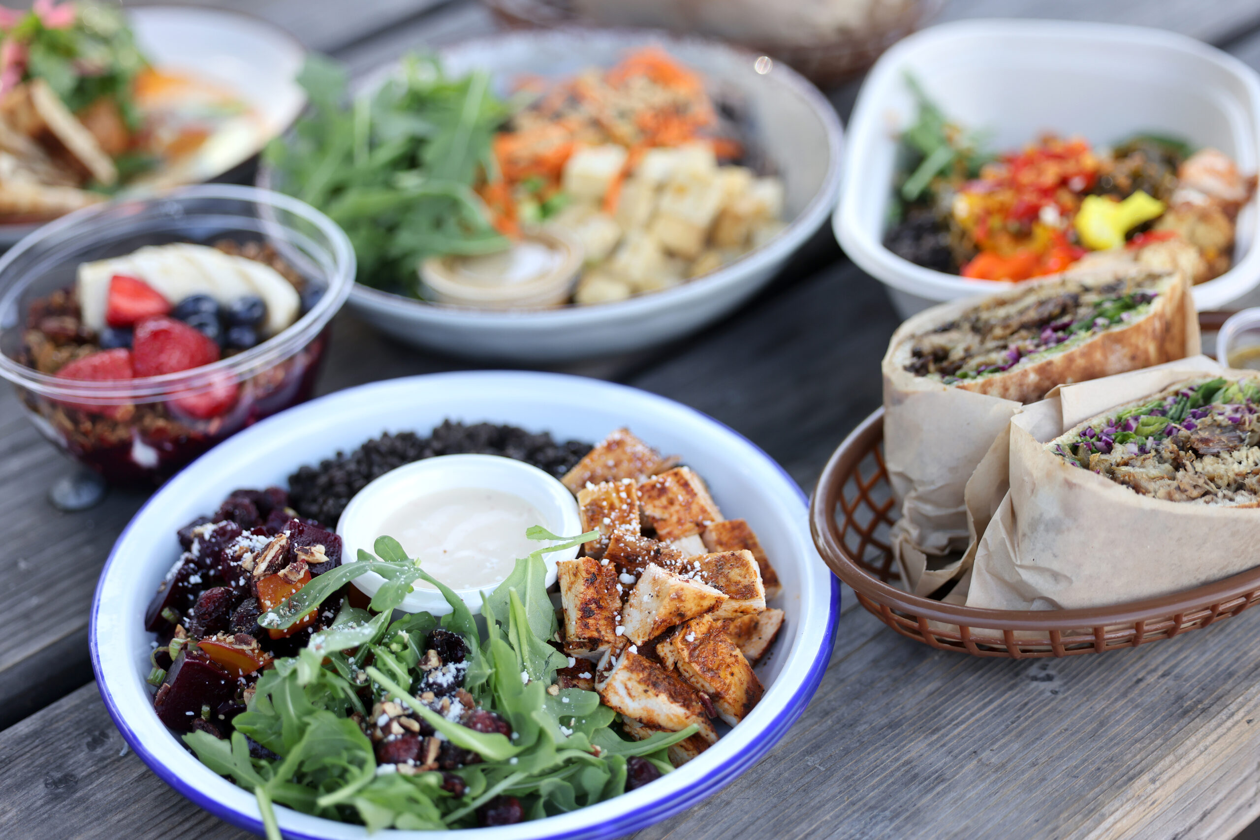 A jerk chicken bowl with mung beans, beets, candied pecans, cotija cheese, pickled red onions, dried cranberries, greens and a honey mustard dressing at Wylde Provisions Co. and playground in Sebastopol Sunday, Aug. 23, 2026. (Beth Schlanker / The Press Democrat)