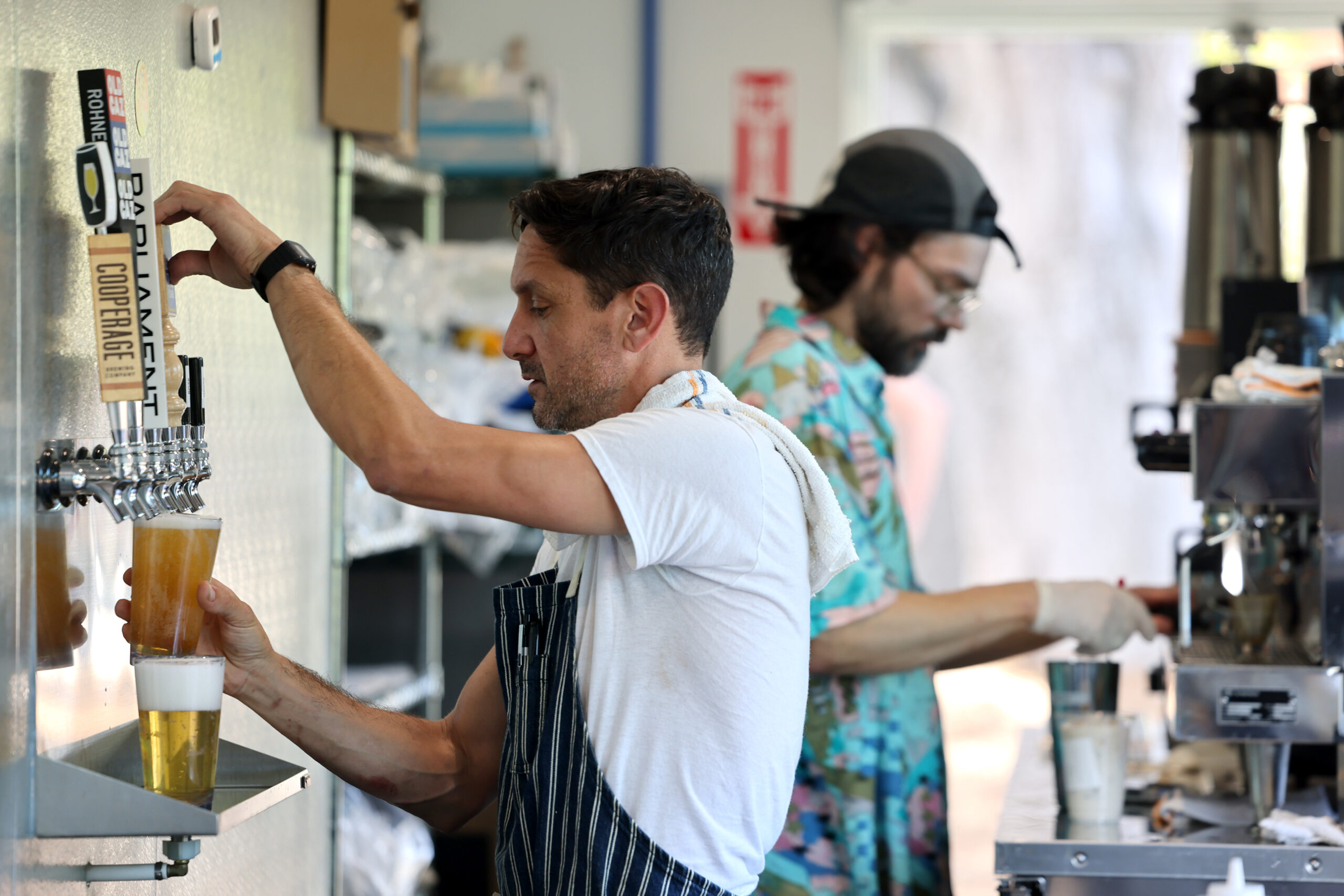 Wylde Provisions Co. head chef Nick Cobarruvias pours a beer on tap in Sebastopol Sunday, Aug. 23, 2026. (Beth Schlanker / The Press Democrat)
