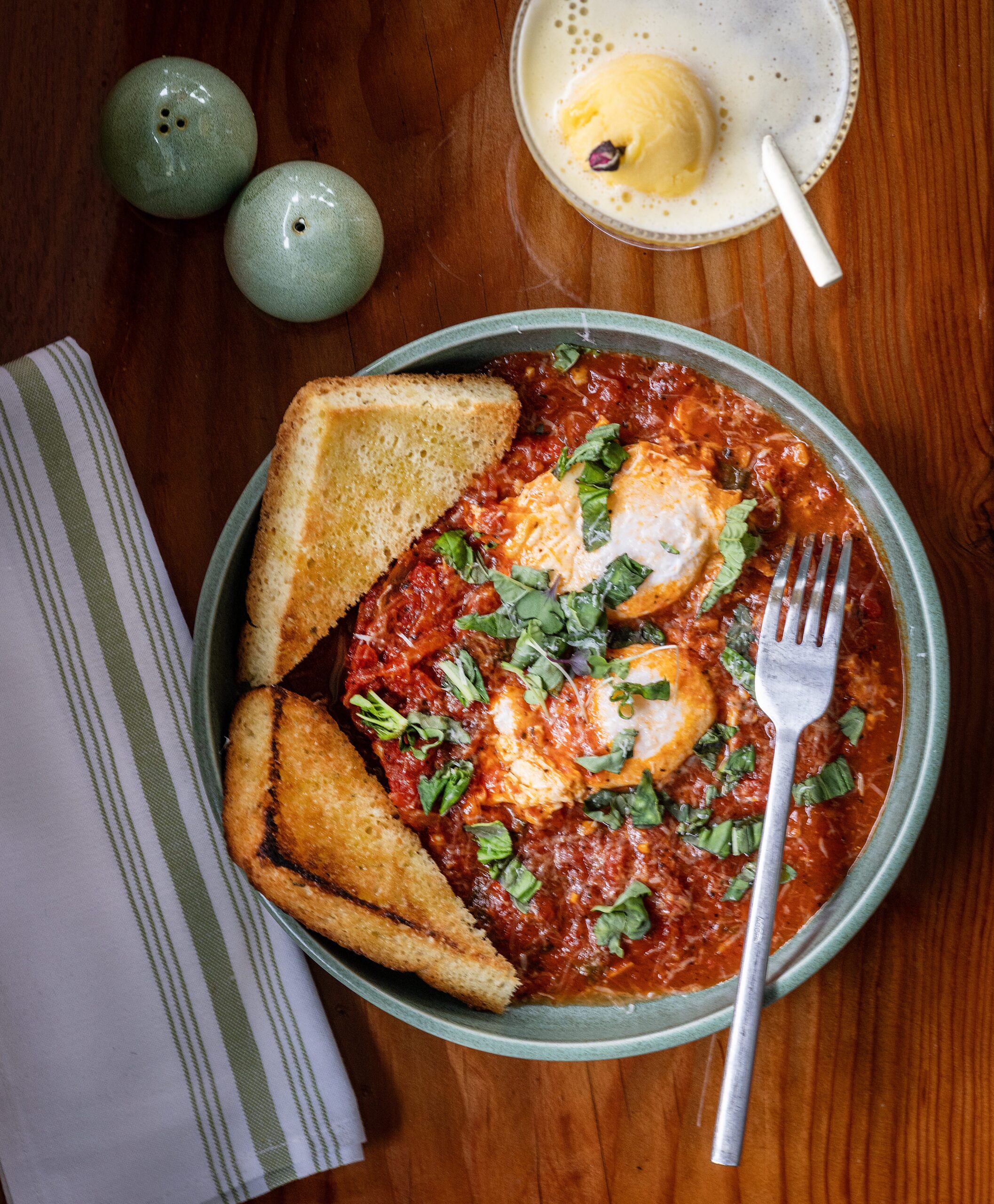 Eggs in Purgatory with an ice cream Champagne float from the Dolce Rosa Café Thursday, August 20, 2026 in Santa Rosa. (John Burgess/The Press Democrat)