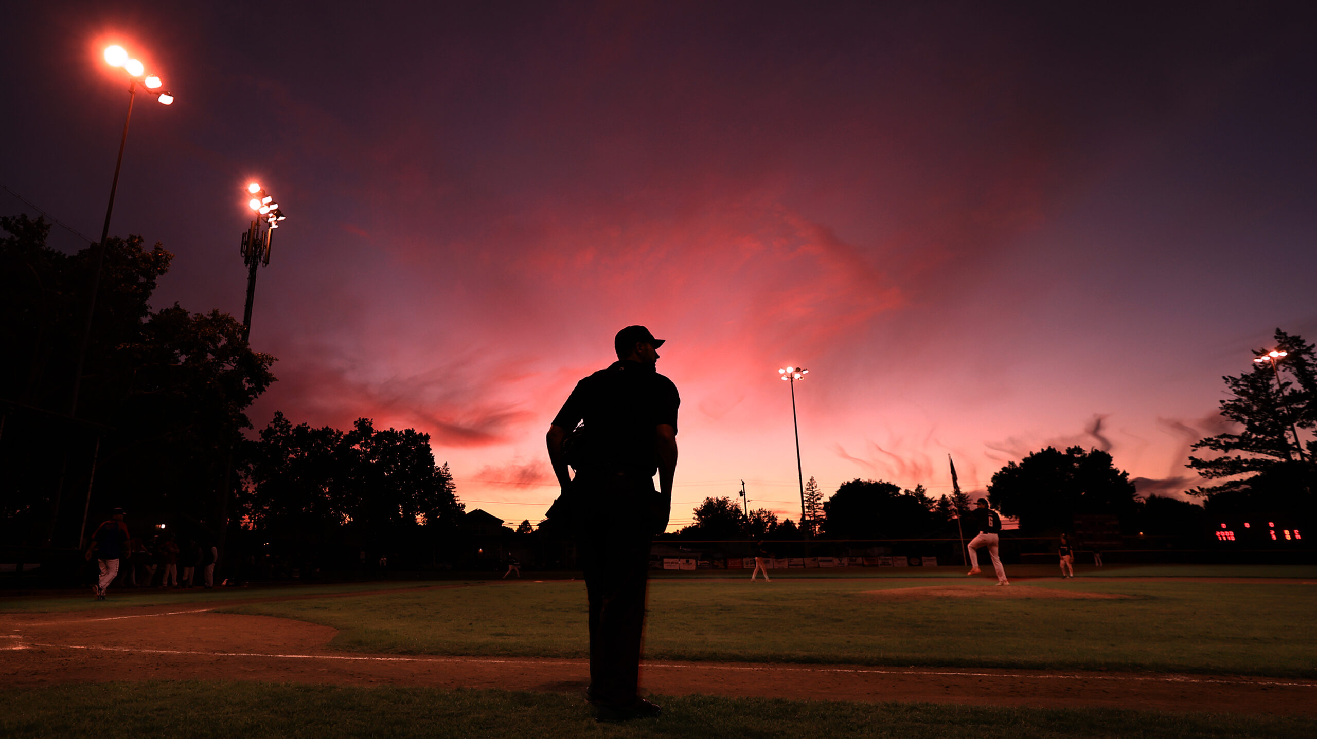 The sun sets as Analy and Healdsburg face off, Friday, April 17, 2026, at Recreation Park in Healdsburg. (Kent Porter / The Press Democrat)