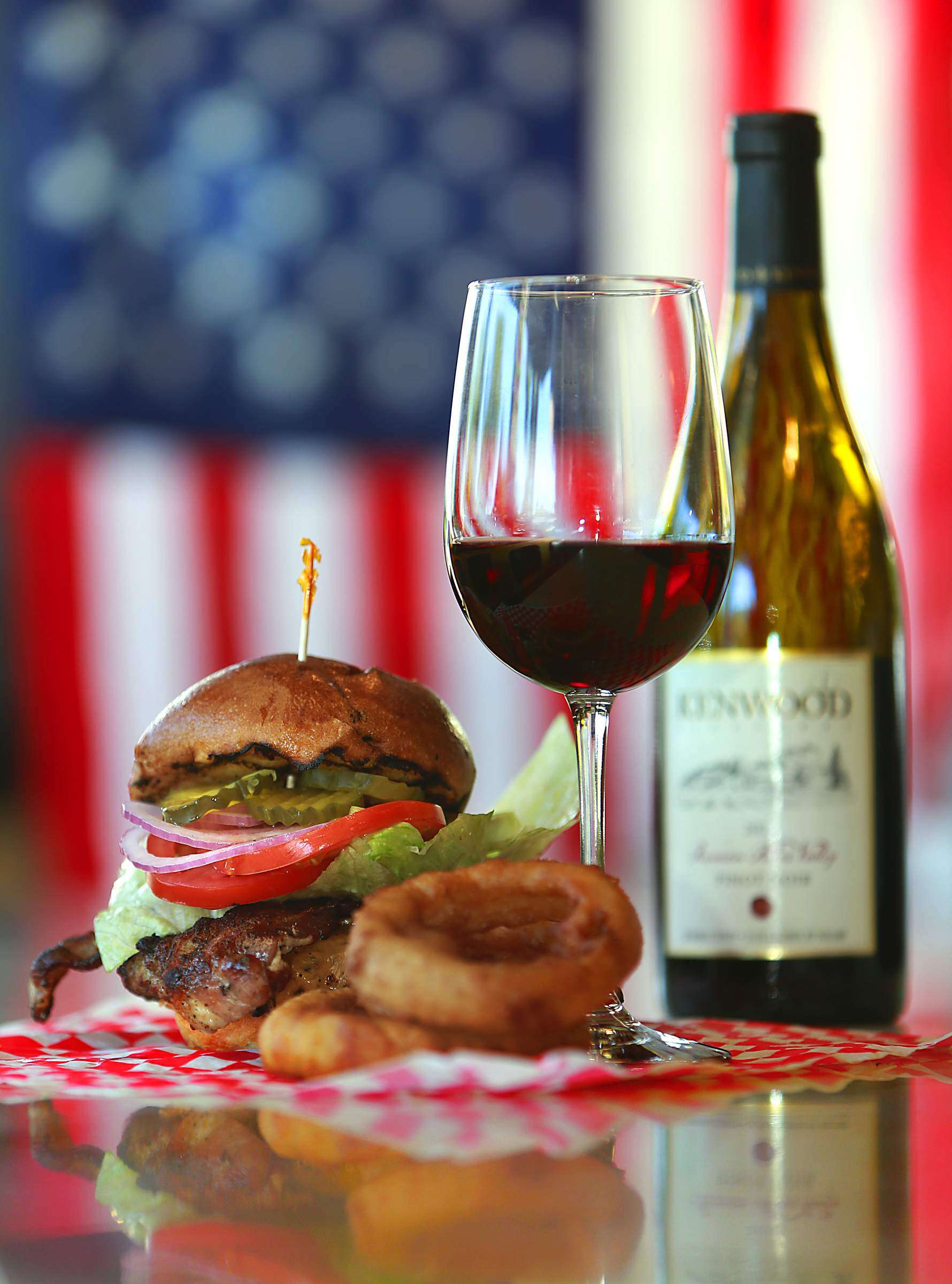 The Superburger burger with the 2012 Kenwood Russian River Valley Pinot Noir. (John Burgess / The Press Democrat, file)