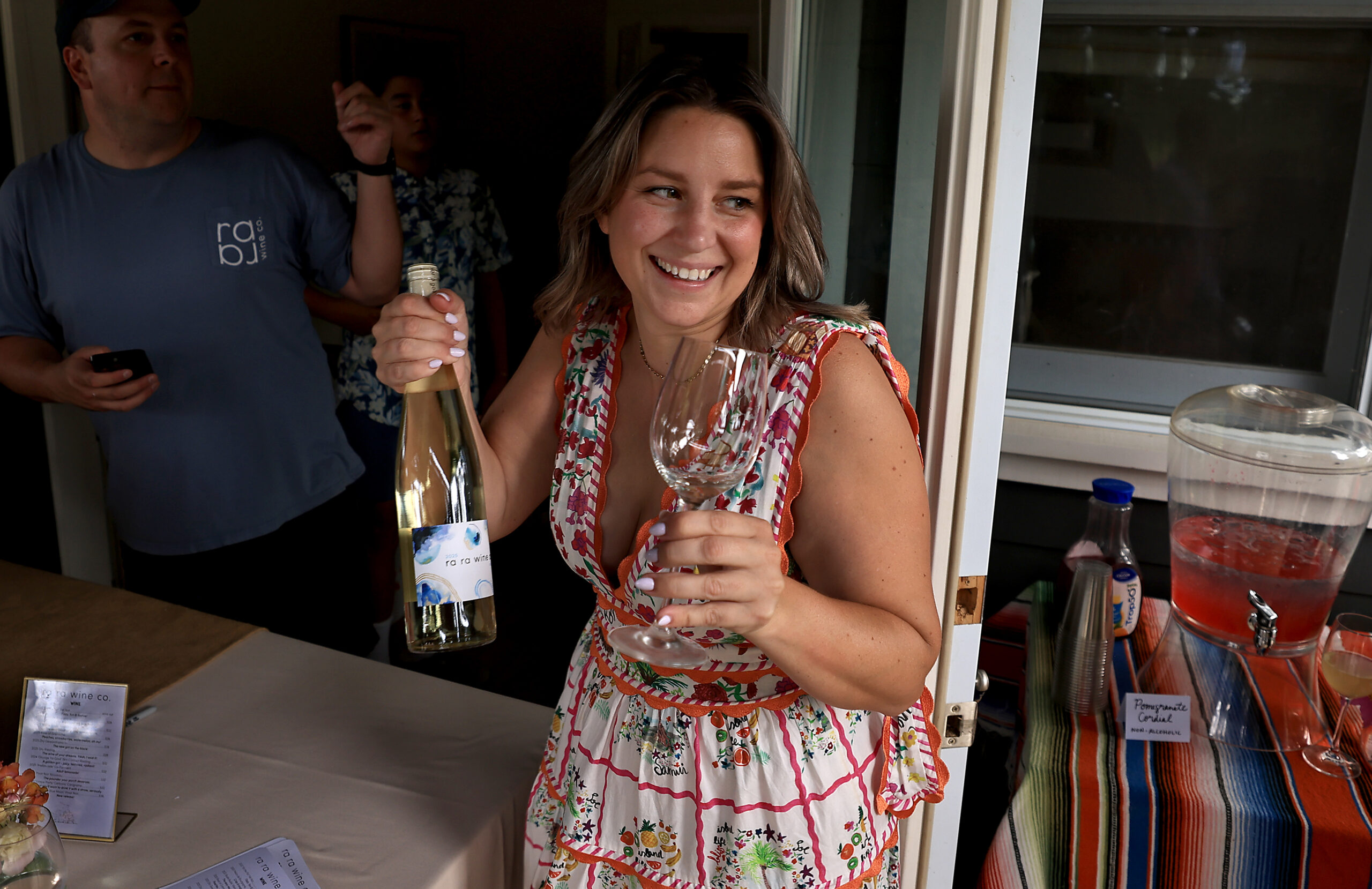 Kara Groom holding wine